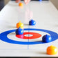 Curling-spil på bordplade