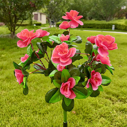 Solcellelampe med simuleret azalea-blomst i jorden