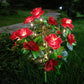 Solcellelampe med simuleret azalea-blomst i jorden
