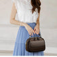 Elegant dobbeltlags crossbody-taske med bred rem