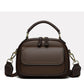 Elegant dobbeltlags crossbody-taske med bred rem