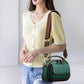 Elegant dobbeltlags crossbody-taske med bred rem