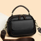 Elegant dobbeltlags crossbody-taske med bred rem